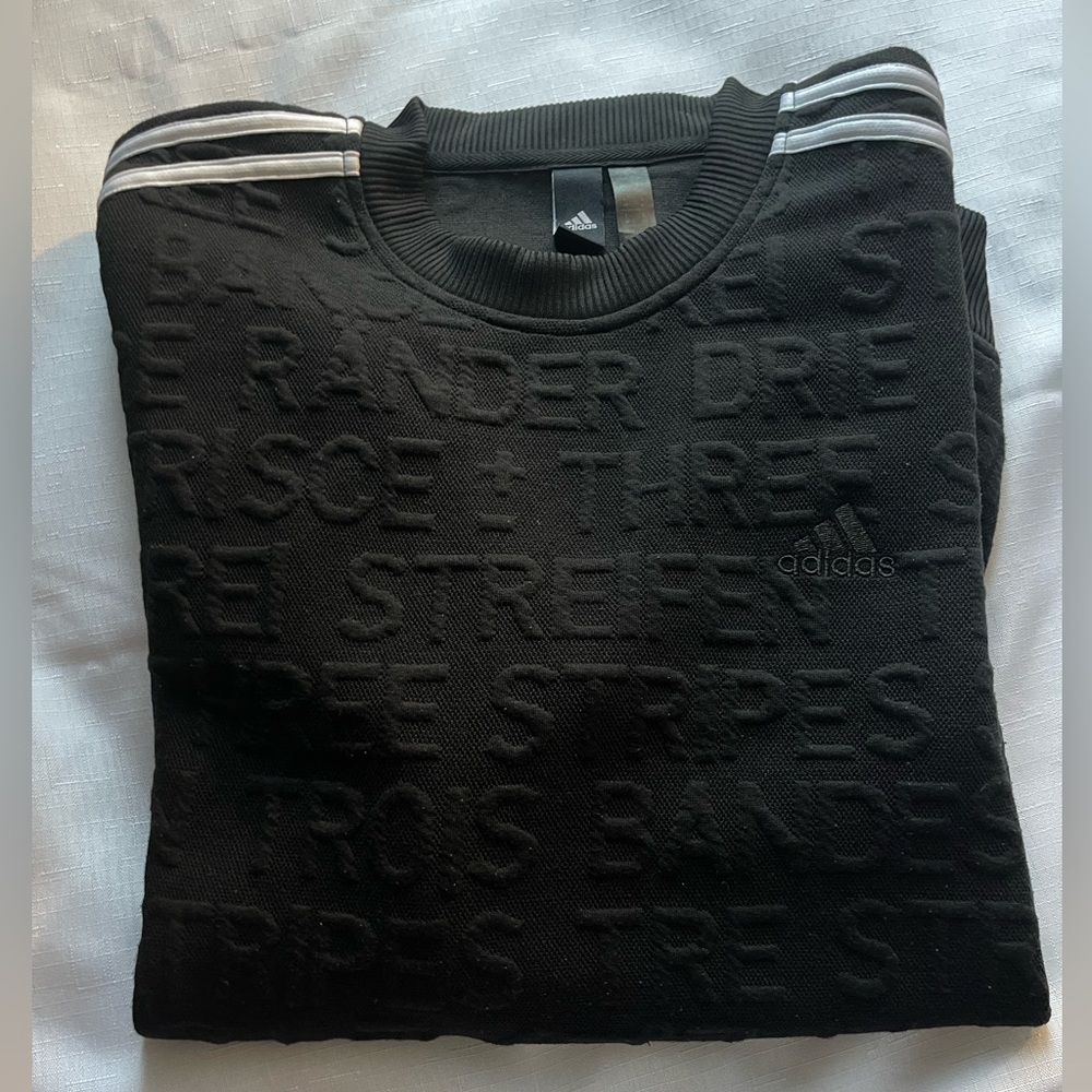 Adidas crewneck sweatshirt with embossed allover word pattern. Size Medium